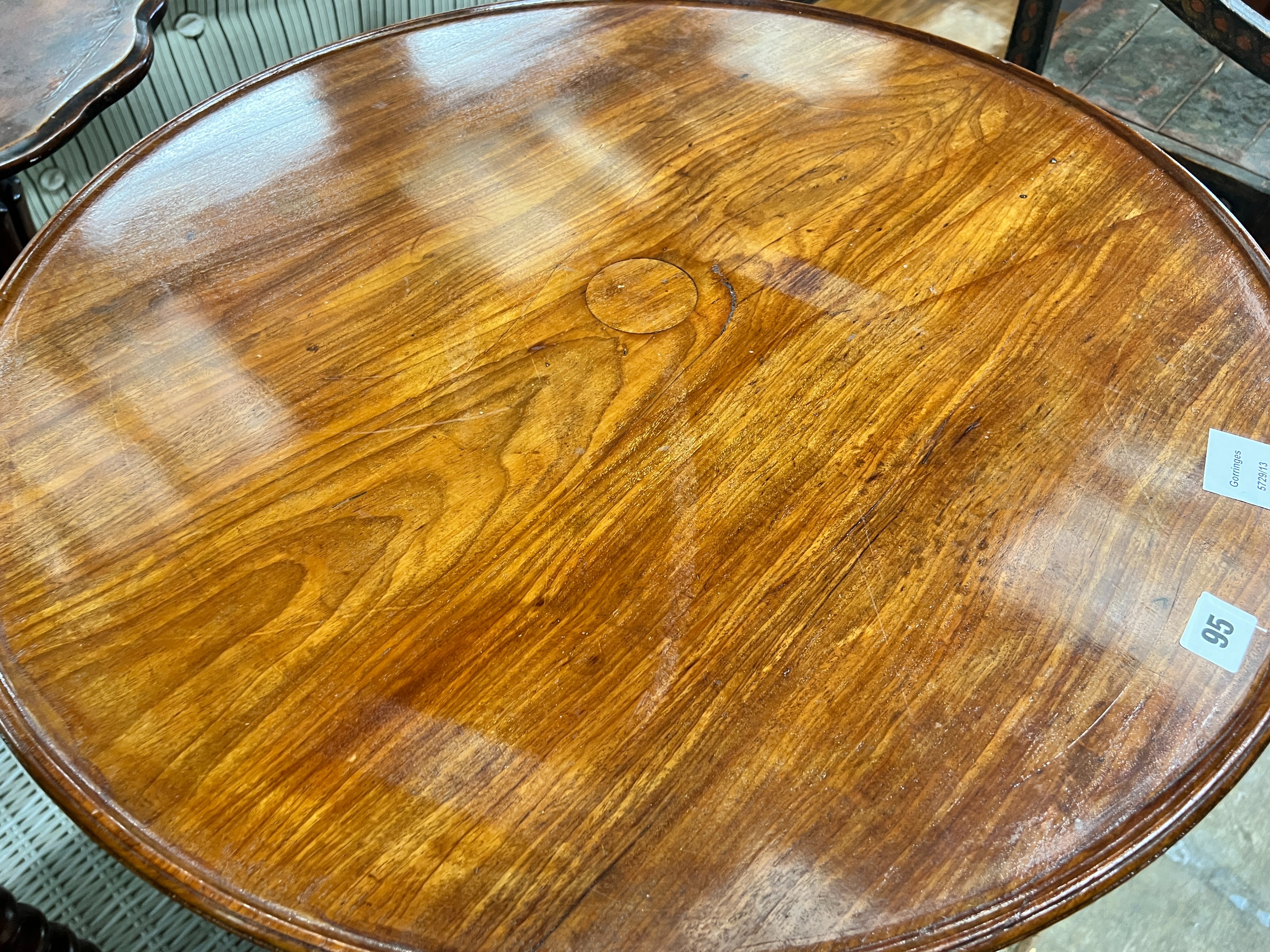 An early Victorian mahogany dish top tea table, diameter 69cm, height 47cm (cut down, converted from a dumb waiter) and a Victorian Sutherland table, width 55cm, depth 16cm, height 63cm